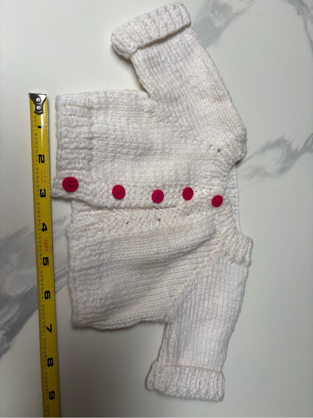White Knit Baby Cardigan with Pink Buttons - Classic Cozy Layer